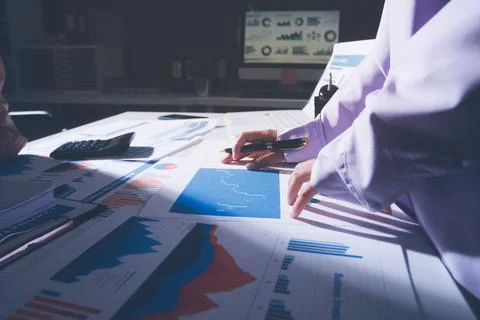 Above table with finance papers, graphs and big data during teamwork meetin.. Stock Photos
