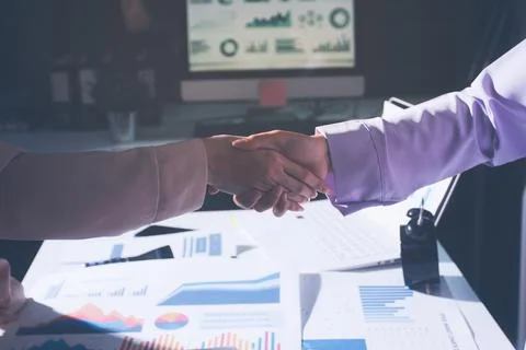Above table with finance papers, graphs and big data during teamwork meetin.. Stock Photos