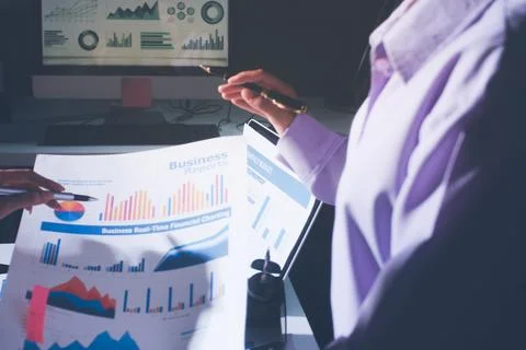Above table with finance papers, graphs and big data during teamwork meetin.. Stock Photos