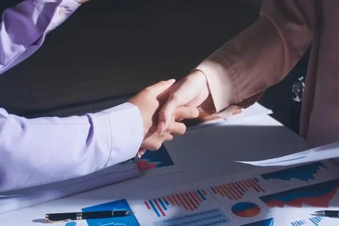 Above table with finance papers, graphs and big data during teamwork meetin.. Stock Photos