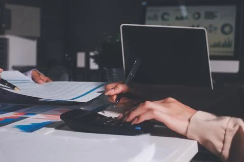 Above table with finance papers, graphs and big data during teamwork meetin.. Stock Photos