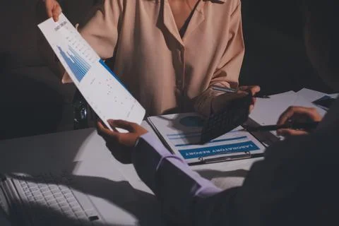 Above table with finance papers, graphs and big data during teamwork meetin.. Stock Photos