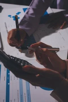 Above table with finance papers, graphs and big data during teamwork meetin.. Stock Photos
