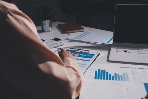 Above table with finance papers, graphs and big data during teamwork meetin.. Stock Photos
