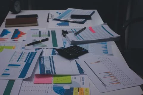 Above table with finance papers, graphs and big data during teamwork meetin.. Stock Photos