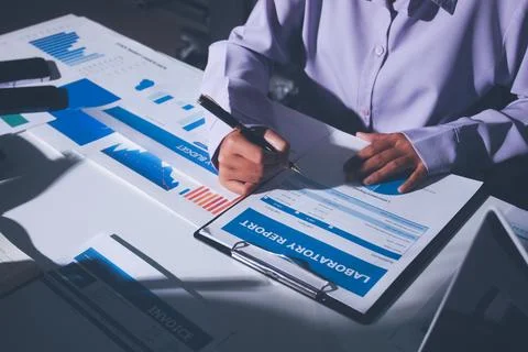 Above table with finance papers, graphs and big data during teamwork meetin.. Stock Photos