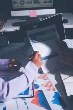 Above table with finance papers, graphs and big data during teamwork meetin.. Stock Photos