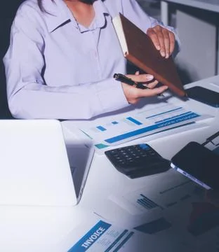 Above table with finance papers, graphs and big data during teamwork meetin.. Stock Photos