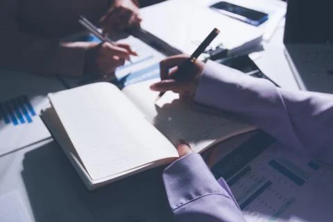 Above table with finance papers, graphs and big data during teamwork meetin.. Stock Photos