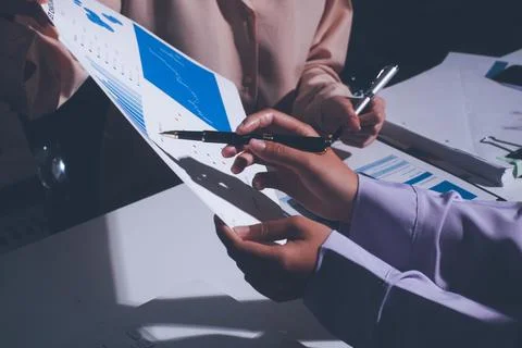 Above table with finance papers, graphs and big data during teamwork meetin.. Stock Photos