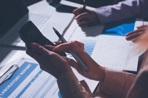 Above table with finance papers, graphs and big data during teamwork meetin.. Stock Photos