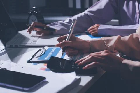 Above table with finance papers, graphs and big data during teamwork meetin.. Stock Photos