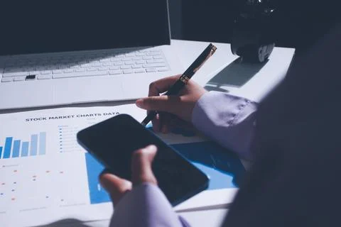 Above table with finance papers, graphs and big data during teamwork meetin.. Stock Photos