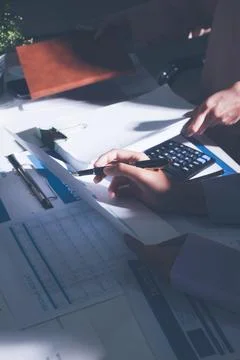 Above table with finance papers, graphs and big data during teamwork meetin.. Stock Photos