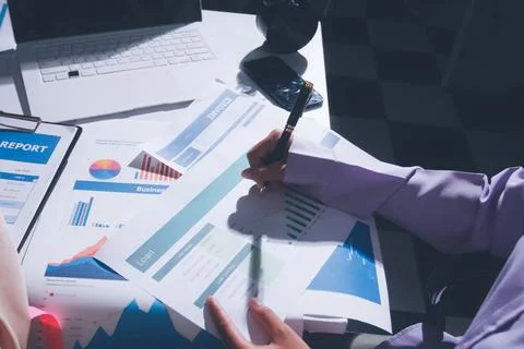 Above table with finance papers, graphs and big data during teamwork meetin.. Stock Photos