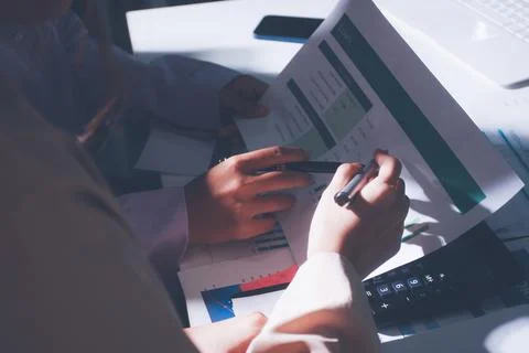 Above table with finance papers, graphs and big data during teamwork meetin.. Stock Photos