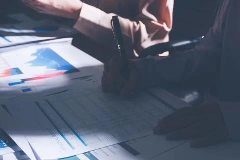 Above table with finance papers, graphs and big data during teamwork meetin.. Stock Photos