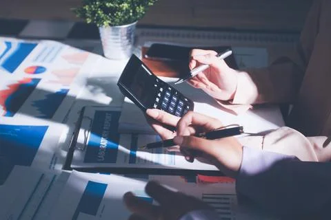 Above table with finance papers, graphs and big data during teamwork meetin.. Stock Photos