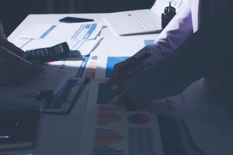 Above table with finance papers, graphs and big data during teamwork meetin.. Stock Photos