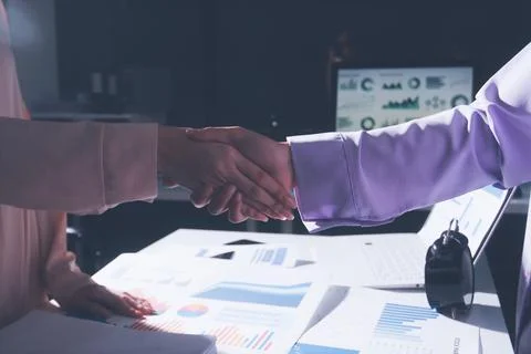 Above table with finance papers, graphs and big data during teamwork meetin.. Stock Photos