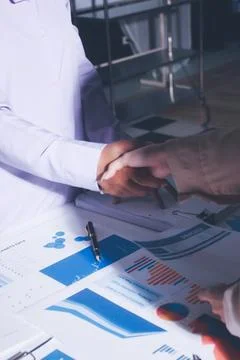 Above table with finance papers, graphs and big data during teamwork meetin.. Stock Photos