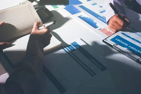 Above table with finance papers, graphs and big data during teamwork meetin.. Stock Photos