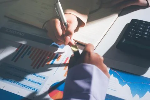 Above table with finance papers, graphs and big data during teamwork meetin.. Stock Photos