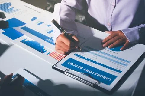 Above table with finance papers, graphs and big data during teamwork meetin.. Stock Photos