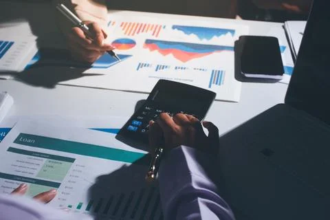 Above table with finance papers, graphs and big data during teamwork meetin.. Stock Photos