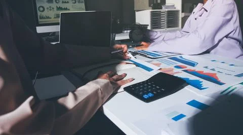Above table with finance papers, graphs and big data during teamwork meetin.. Stock Photos