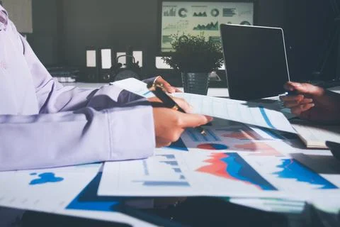 Above table with finance papers, graphs and big data during teamwork meetin.. Stock Photos