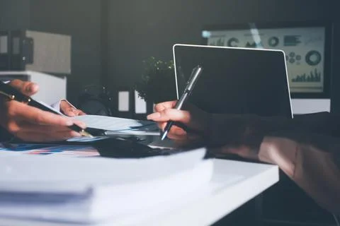 Above table with finance papers, graphs and big data during teamwork meetin.. Stock Photos