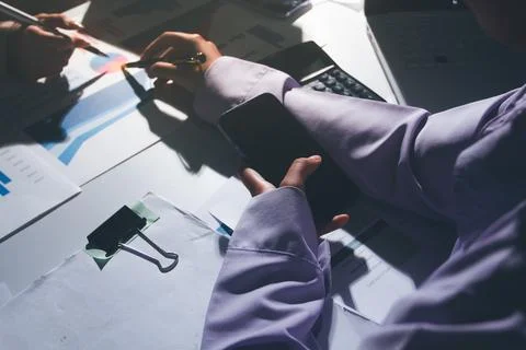 Above table with finance papers, graphs and big data during teamwork meetin.. Stock Photos