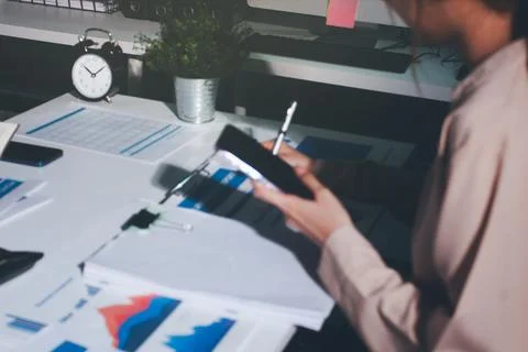 Above table with finance papers, graphs and big data during teamwork meetin.. Stock Photos