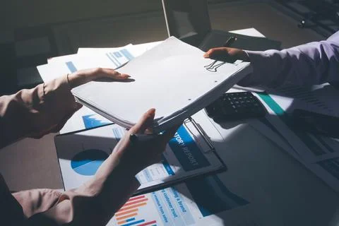 Above table with finance papers, graphs and big data during teamwork meetin.. Stock Photos