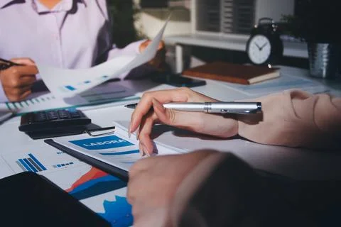 Above table with finance papers, graphs and big data during teamwork meetin.. Stock Photos
