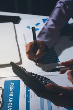 Above table with finance papers, graphs and big data during teamwork meetin.. Stock Photos
