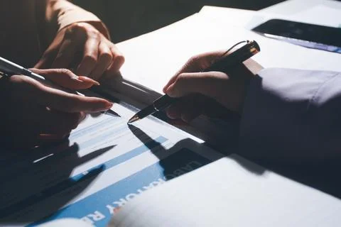 Above table with finance papers, graphs and big data during teamwork meetin.. Stock Photos