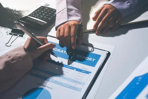 Above table with finance papers, graphs and big data during teamwork meetin.. Stock Photos