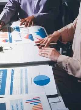Above table with finance papers, graphs and big data during teamwork meetin.. Stock Photos
