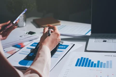 Above table with finance papers, graphs and big data during teamwork meetin.. Stock Photos