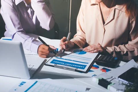 Above table with finance papers, graphs and big data during teamwork meetin.. Stock Photos