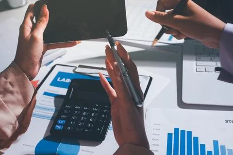 Above table with finance papers, graphs and big data during teamwork meetin.. Stock Photos