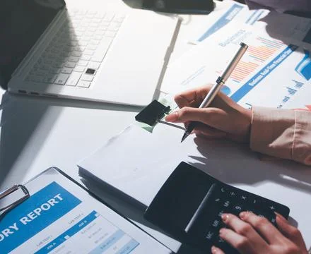 Above table with finance papers, graphs and big data during teamwork meetin.. Stock Photos