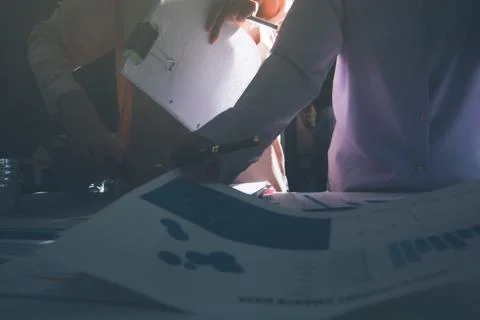 Above table with finance papers, graphs and big data during teamwork meetin.. Stock Photos