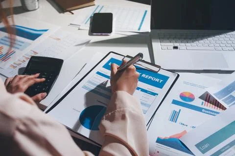 Above table with finance papers, graphs and big data during teamwork meetin.. Stock Photos