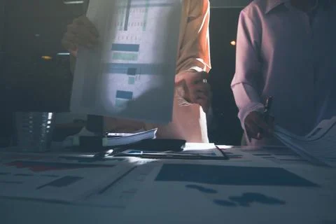 Above table with finance papers, graphs and big data during teamwork meetin.. Stock Photos
