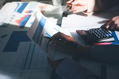Above table with finance papers, graphs and big data during teamwork meetin.. Stock Photos
