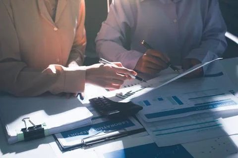 Above table with finance papers, graphs and big data during teamwork meetin.. Stock Photos