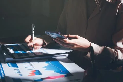 Above table with finance papers, graphs and big data during teamwork meetin.. Stock Photos